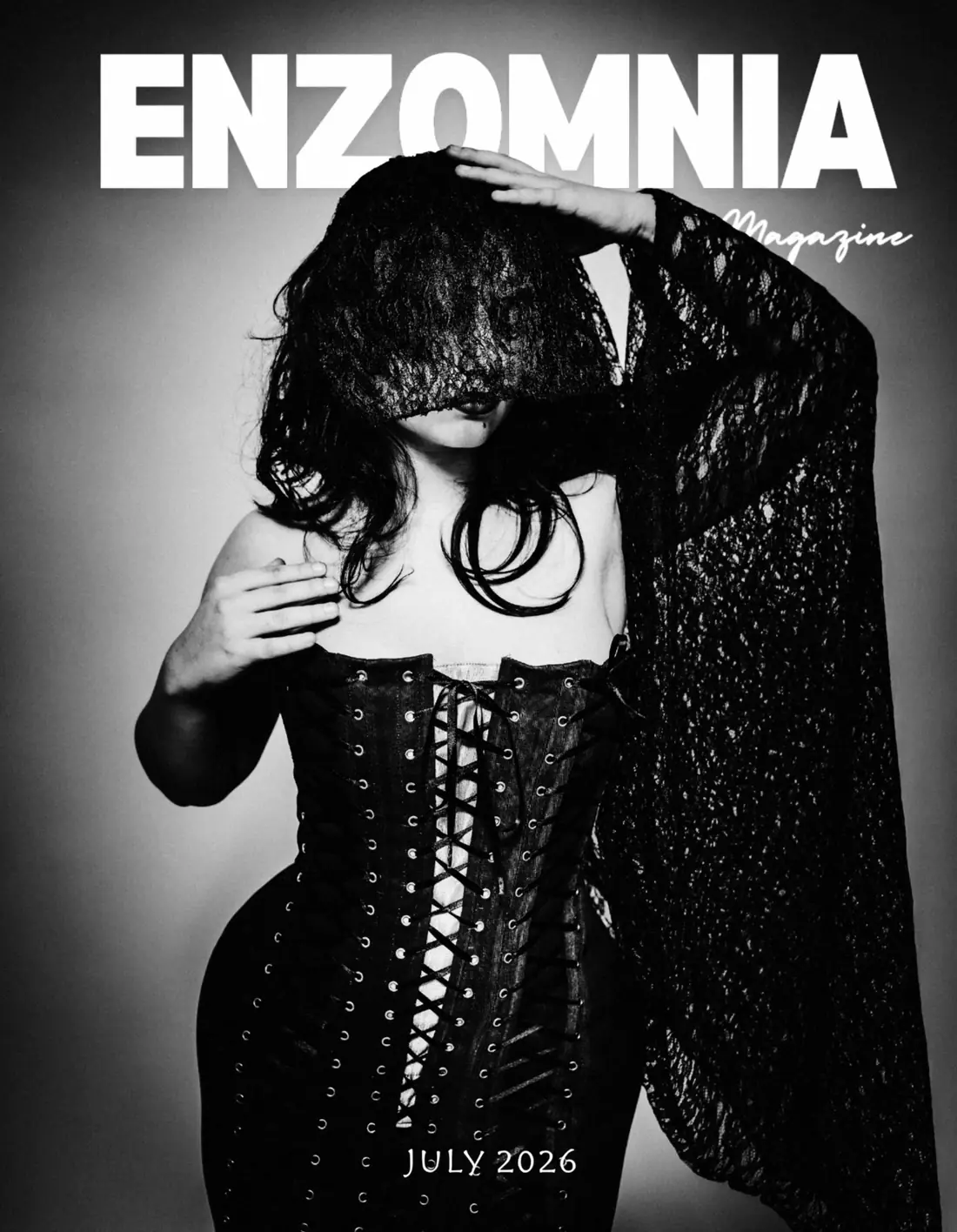 Back cover of Enzomnia Magazine: a laced corset under a sheer lace veil, dated July 2026.