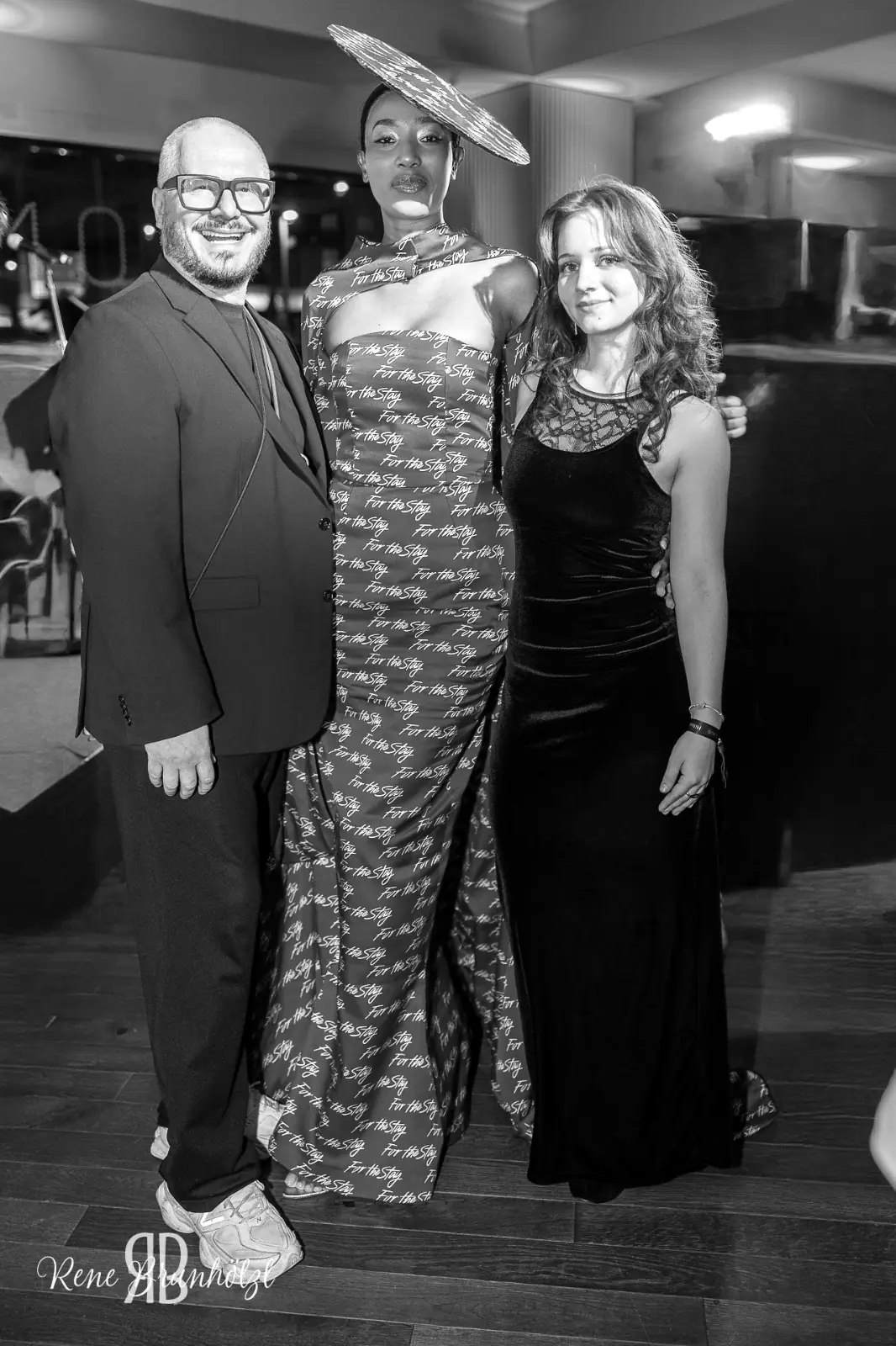 Costina Cindea at the presentation, beside the model wearing the dress.